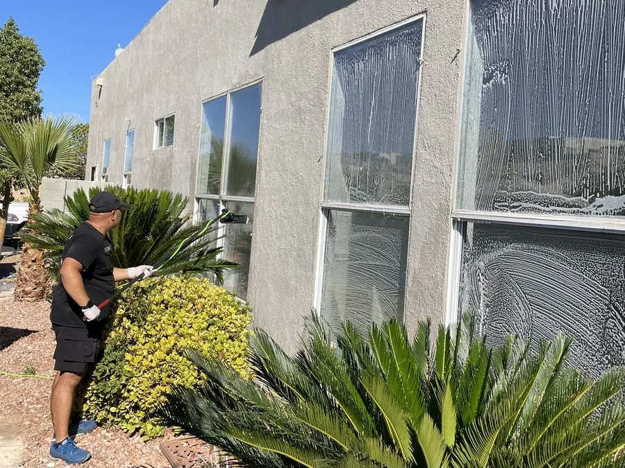 The Clean Guys washing exterior windows on Las Vegas home