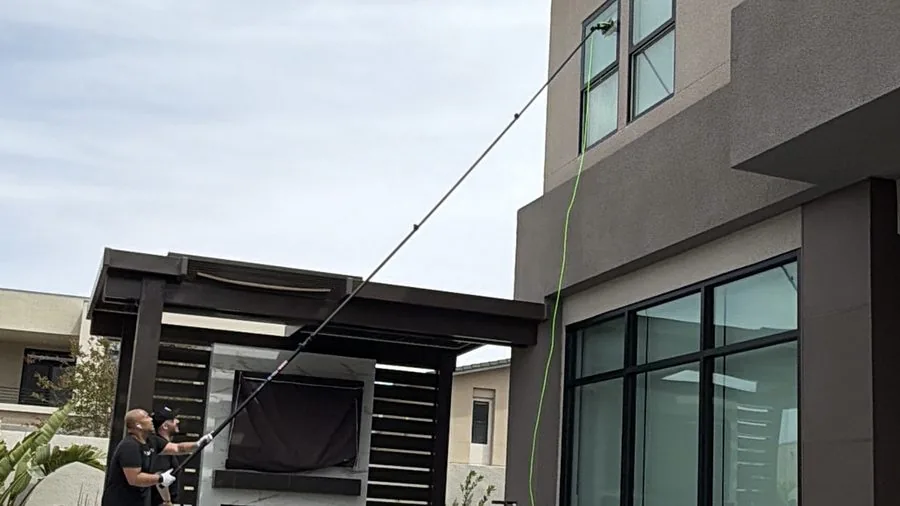 The Clean Guys team cleaning two-story luxury home windows Las Vegas